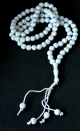 Chapelet "Sebha" blanc a 99 grains avec decorations argentees