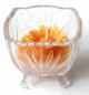 Bougie parfumee sous forme de fleur de couleur orange dans un joli recipient en verre