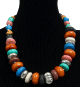 Collier ethnique artisanal imitation pieces spheriques en tagua et pierres difformes multicolores