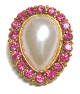 Broche ovale perle blanche entouree de diamants roses
