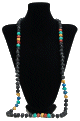Long collier ethnique artisanal imitation pierres couleur noire agrémenté de perles et autres pierres colorées Long collier ethnique artisanal imitation pierres couleur noire agremente de perles et autres pierres colorees